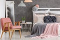 Pretty pink bedroom with chair Royalty Free Stock Photo