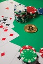 Classic playing cards, chips, red dice, bitcoin and dollars on green background. Royalty Free Stock Photo