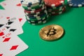 Classic playing cards, chips, red dice, bitcoin and dollars on green background. Royalty Free Stock Photo