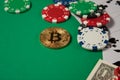 Classic playing cards, chips, red dice, bitcoin and dollars on green background. Royalty Free Stock Photo