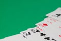 Classic playing cards on green background. Gambling and casino concept.