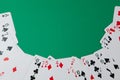Classic playing cards on green background. Gambling and casino concept.