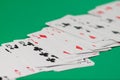 Classic playing cards on green background. Gambling and casino concept. Royalty Free Stock Photo