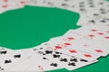 Classic playing cards on green background. Gambling and casino concept.