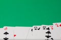 Classic playing cards on green background. Gambling and casino concept. Royalty Free Stock Photo