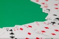 Classic playing cards on green background. Gambling and casino concept.