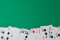 Classic playing cards on green background. Gambling and casino concept.