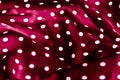 Classic polka dot textile background texture, white dots on red luxury fabric design pattern Royalty Free Stock Photo