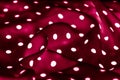 Classic polka dot textile background texture, white dots on red luxury fabric design pattern Royalty Free Stock Photo