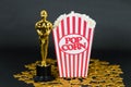 Classic popcorn box, Oscar award and golden stars