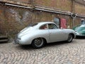 Classic Porsche 356 Coupe parked on a cobblestone road Royalty Free Stock Photo