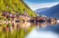 Classic postcard view of famous Hallstatt lakeside town reflecting in Hallstattersee lake in the Austrian Alps in scenic morning Royalty Free Stock Photo