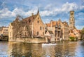 Historic city of Brugge with tourist boat, Flanders, Belgium