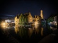 Classic postcard view illuminated historical medieval buildings Rozenhoedkaai Dijver canal belfry belfort Bruges Belgium Royalty Free Stock Photo