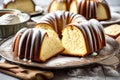 A classic pound cake, baked to perfection in a bundt pan, showcasing its traditional vanilla or sour cream flavor and delicately Royalty Free Stock Photo