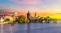 Classic Prague panorama with Old Town Bridge Tower and Charles bridge over Vltava river at sunset, Czech Republic