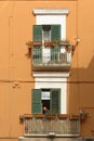 Classic puglia apartment exterior with wrought-iron balconies