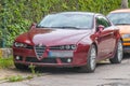 Old red sport car Alfa Romeo Brera parked front left side view