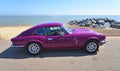 Classic Purple Triumph GT6 Parked on seafront Promenade.