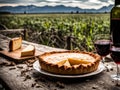 A classic quiche Lorraine pie with potatoes meat and cheese on a wooden table