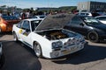 Classic rally car Opel Manta B2 400 with open hood in street