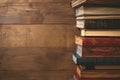 Classic reading setup Old hardback books on a rustic table