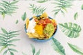 Classic recipe of nachos with guacamole, stewed black beans, cheddar and cream cheese, corn chips and guacamole with pico de gallo