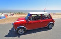 Classic Red Austin Mini Car parked on seafront promenade. Royalty Free Stock Photo