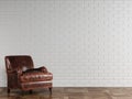 Classic red brown leather armchair standing in front of white brick wall with copy space Royalty Free Stock Photo