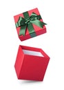 Classic red flying open gift box with green satin bow