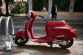 Classic red old style Giorno scooter stands parked on the sidewalk: Moscow, Russia - May 26, 2021 Royalty Free Stock Photo