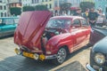 Classic vintage red Saab 96 two stroke motor parked