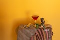 Classic Red Pink Manhattan Cosmopolitan Martini glass cocktail and bartender accessories. Bright yellow background. Stay at home Royalty Free Stock Photo