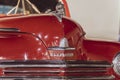 Classic Red Plymouth Car from 1950s close up of hood and bumper with logo Royalty Free Stock Photo