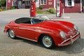 Red Porsche Convertible Speedster in front Gas Station Royalty Free Stock Photo