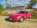 Classic red sport car Alfa Romeo T.Spark Gio parked front left side view