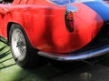 Classic red sports car fuel cap and tail fin