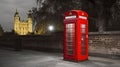 Classic, red telephone booth in front of the Tower, Generative AI Royalty Free Stock Photo