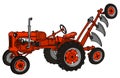 The classic red tractor with a plough Royalty Free Stock Photo