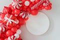 Classic red and white Christmas party decorations with helium balloons. Christmas mockup. Happy new year photo session decor idea Royalty Free Stock Photo