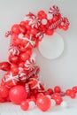 Classic red and white Christmas party decorations with helium balloons. Christmas mockup. Happy new year photo session decor idea Royalty Free Stock Photo