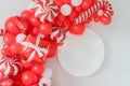 Classic red and white Christmas party decorations with helium balloons. Christmas mockup. Happy new year photo session decor idea Royalty Free Stock Photo