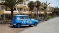 Classic Renault Car being driven along Playa Blanca seafront promenade.