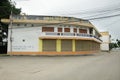 Classic retro commercial building and house in small alley