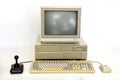 Classic Retro PC from the Eighties with Monitor, Mouse and Joystick. Used for Gaming, Writing and Graphics on White