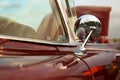 Classic retro vintage red car. Car mirror. Royalty Free Stock Photo