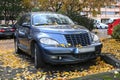 Classic retro vintage veteran compact hatchback car Chrysler PT Cruiser parked