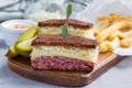 Classic reuben sandwich, served with dill pickle, potato chips, horizontal Royalty Free Stock Photo