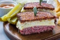 Classic reuben sandwich, served with dill pickle, potato chips, horizontal Royalty Free Stock Photo