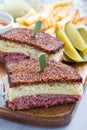 Classic reuben sandwich, served with dill pickle, potato chips, vertical Royalty Free Stock Photo